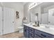 Well-lit bathroom boasting a double vanity with modern fixtures and ample storage space at 11159 E Sebring Ave, Mesa, AZ 85212