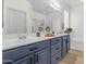 The bathroom is spacious and features a shower, a tub, and a large double sink vanity at 11159 E Sebring Ave, Mesa, AZ 85212