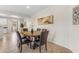Warm dining room adjacent to the kitchen, ideal for Gathering meals and gatherings at 11159 E Sebring Ave, Mesa, AZ 85212