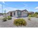 Attractive single-story home with desert landscaping and a neutral color palette at 11159 E Sebring Ave, Mesa, AZ 85212