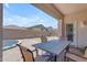 Covered patio featuring a dining table with chairs, offering a relaxing outdoor space for meals and gatherings at 11159 E Sebring Ave, Mesa, AZ 85212
