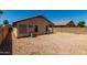 Full view of the backyard that is low maintenance and has plenty of space at 15231 W Melissa Ln, Surprise, AZ 85374