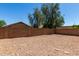 This spacious backyard with lots of gravel offers privacy and versatility at 15231 W Melissa Ln, Surprise, AZ 85374