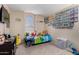 Comfortable bedroom with plenty of natural light and play area at 15231 W Melissa Ln, Surprise, AZ 85374