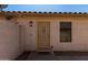Inviting front entrance with security door, decorative lantern, and a charming 'HELLO' welcome mat at 15231 W Melissa Ln, Surprise, AZ 85374