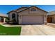Attractive single-level home features a two-car garage, desert landscaping, and a cozy entryway at 15231 W Melissa Ln, Surprise, AZ 85374