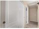 Hallway with storage closet, neutral paint, and leads to the bathroom at 15231 W Melissa Ln, Surprise, AZ 85374