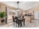 Open kitchen concept with breakfast bar, dining area and stainless steel microwave at 15231 W Melissa Ln, Surprise, AZ 85374