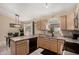An open kitchen with sleek appliances adjacent to a dining area at 15231 W Melissa Ln, Surprise, AZ 85374
