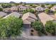Residential neighborhood showcasing well-kept homes, mature trees, and tile roofs, indicating a Gathering-friendly community at 154 W Hayden Park Rd, San Tan Valley, AZ 85143