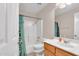 Bathroom with shower/tub combo, toilet, and vanity with a cabinet at 154 W Hayden Park Rd, San Tan Valley, AZ 85143