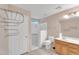 Bathroom featuring tiled shower with grab bars and updated fixtures at 154 W Hayden Park Rd, San Tan Valley, AZ 85143