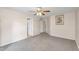 Spacious bedroom with neutral carpeting and ceiling fan at 154 W Hayden Park Rd, San Tan Valley, AZ 85143