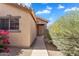 Inviting home exterior showcasing a well-maintained walkway and lush landscaping, perfect for curb appeal at 154 W Hayden Park Rd, San Tan Valley, AZ 85143