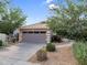 Inviting home with neat front yard landscaping, a wide driveway and attached two-car garage, offering curb appeal and convenience at 154 W Hayden Park Rd, San Tan Valley, AZ 85143