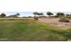 Scenic golf course view with lush green fairway and desert landscape, promoting outdoor recreation and a tranquil environment at 154 W Hayden Park Rd, San Tan Valley, AZ 85143