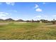 Beautiful golf course showcasing a serene pond, fountain, and meticulously manicured green, promising a luxurious lifestyle at 154 W Hayden Park Rd, San Tan Valley, AZ 85143