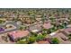 Residential area featuring well-maintained homes, mature trees, and desert landscaping at 15539 W La Salinas Ln, Surprise, AZ 85374