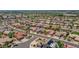 Aerial view showcasing the desert home's location within a well-maintained and verdant residential neighborhood at 15539 W La Salinas Ln, Surprise, AZ 85374
