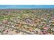 Aerial view showcasing the desert home's scenic location near a golf course in a vibrant community at 15539 W La Salinas Ln, Surprise, AZ 85374