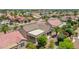 Aerial shot of a suburban community with mature trees and well-maintained desert landscaping at 15539 W La Salinas Ln, Surprise, AZ 85374