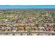 Aerial shot showcasing the desert home in a lush neighborhood with convenient golf course access at 15539 W La Salinas Ln, Surprise, AZ 85374