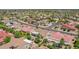 Serene neighborhood showcasing mature trees, verdant landscaping, and green spaces throughout at 15539 W La Salinas Ln, Surprise, AZ 85374