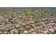 Aerial view showing the desert home's proximity to verdant green spaces, golf course, and other well-kept homes at 15539 W La Salinas Ln, Surprise, AZ 85374