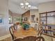 Open-concept dining room leading to a living area with comfortable seating at 15539 W La Salinas Ln, Surprise, AZ 85374