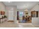 Elegant dining room featuring a chandelier, wooden table, and built-in shelving at 15539 W La Salinas Ln, Surprise, AZ 85374
