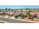 Beautiful desert home featuring mature landscaping, desert-style rock features, and a large two-car garage at 15539 W La Salinas Ln, Surprise, AZ 85374