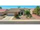 Inviting single-story home with a well-manicured desert landscape and a spacious two-car garage at 15539 W La Salinas Ln, Surprise, AZ 85374