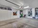 Spacious garage featuring ample cabinet storage, water heater, and plenty of open space at 15539 W La Salinas Ln, Surprise, AZ 85374