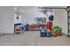 Organized garage space with workbenches and storage solutions at 15539 W La Salinas Ln, Surprise, AZ 85374