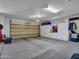 Spacious garage with ample storage cabinets at 15539 W La Salinas Ln, Surprise, AZ 85374