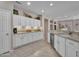 Spacious kitchen featuring bright cabinets, granite counter tops, and an open floor plan at 15539 W La Salinas Ln, Surprise, AZ 85374