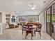 Bright living room open to the dining area with view of the backyard at 15539 W La Salinas Ln, Surprise, AZ 85374