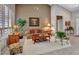Comfortable living room features bright walls, stylish furniture and ample light at 15539 W La Salinas Ln, Surprise, AZ 85374