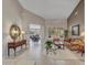 Bright living room with tiled floors, comfortable seating, and natural light at 15539 W La Salinas Ln, Surprise, AZ 85374