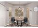 Bright breakfast nook with a round table and two chairs set in a bay window, perfect for morning coffee at 1707 W Stanford Ave, Gilbert, AZ 85233