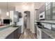 Modern kitchen with stainless steel appliances, granite countertops, ample storage, and stylish finishes at 1707 W Stanford Ave, Gilbert, AZ 85233
