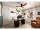Office space featuring hardwood floors, modern lighting, a desk, and comfortable seating at 1707 W Stanford Ave, Gilbert, AZ 85233