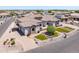 Expansive aerial view of the estate featuring a three-car garage, manicured landscaping, and paver driveway at 18036 W San Miguel Ave, Litchfield Park, AZ 85340
