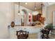 Stylish bar area with granite countertops, pendant lighting, and comfortable seating in a modern design at 18036 W San Miguel Ave, Litchfield Park, AZ 85340
