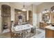 Luxurious bathroom featuring a jacuzzi tub, walk-in shower, and custom vanity with beautiful mirrors at 18036 W San Miguel Ave, Litchfield Park, AZ 85340