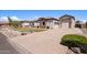 Expansive property with well-manicured landscaping and a circular paver driveway, boasting exceptional curb appeal at 18036 W San Miguel Ave, Litchfield Park, AZ 85340