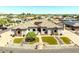Desirable single Gathering home showcasing a decorative grass lawn, stone accents and a spacious driveway at 18036 W San Miguel Ave, Litchfield Park, AZ 85340