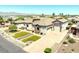 Beautiful single Gathering home with a desert landscape, three car garage and stylish front exterior at 18036 W San Miguel Ave, Litchfield Park, AZ 85340