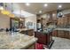 Chef's kitchen with granite countertops, stainless appliances and a center island at 18036 W San Miguel Ave, Litchfield Park, AZ 85340