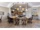 Gourmet kitchen featuring a large island with seating and custom cabinets at 18036 W San Miguel Ave, Litchfield Park, AZ 85340